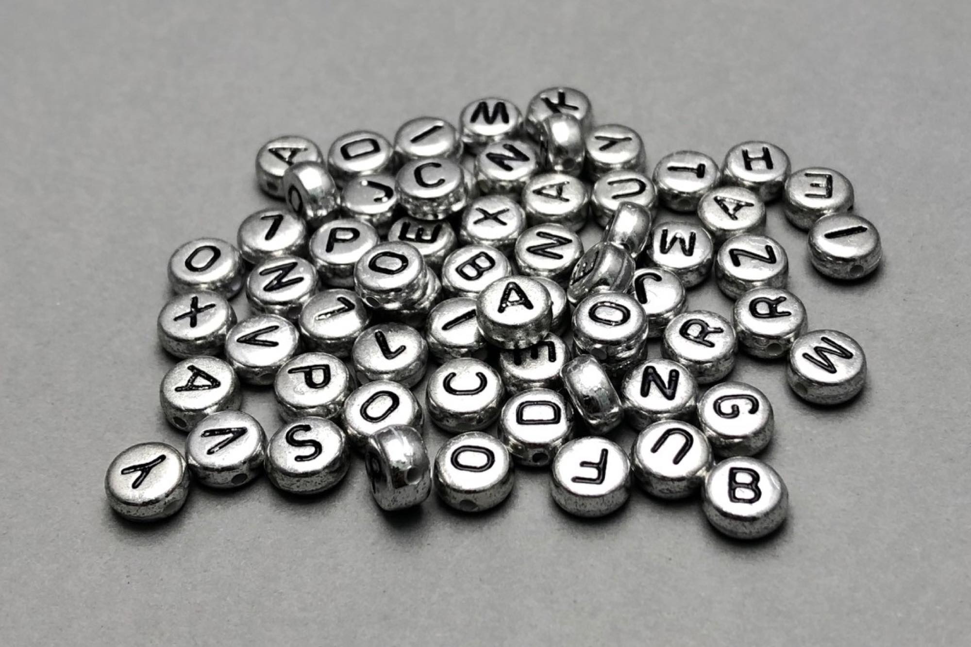 Silver Flat Round Acrylic Alphabet Beads 7x4mm, 0.9mm Hole, Pack